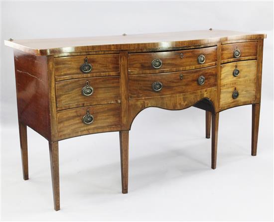 A George III mahogany serpentine sideboard, W.6ft